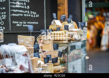 LONDON, UK - NOVEMBER 13, 2018 - Cheese and other quality Italian products such as Salami at London's famous markets located near the Borough Market Stock Photo