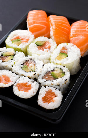 sushi pack with nigiri and maki on black background Stock Photo