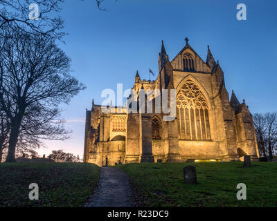 The East Front of Ripon Cathedral floodlit at dusk Ripon North Yorkshire England