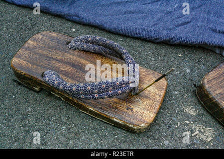 Japanese sandal in park with incense burning Stock Photo