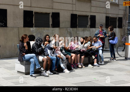 Vienna, Austria group of school children pupils taking a lunch break with teacher in city centre Stock Photo