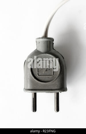 Old electric plug isolated on a white background, close-up Stock Photo
