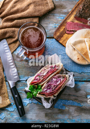 Pastrami beef sandwich wit coleslaw salad, copy space. Stock Photo