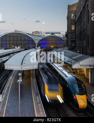 London, England, UK - September 21, 2018: A Great Western Railway Intercity 125 passenger train departs London's Paddington Station while a Class 800  Stock Photo