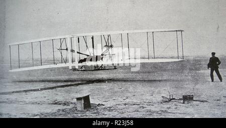 The 'Flyer' makes a perfect take-off. Orville Wright, arranged that this photograph would be taken of the first controlled, sustained and powered heavier-than-air flight. 17th December, 1903. Stock Photo