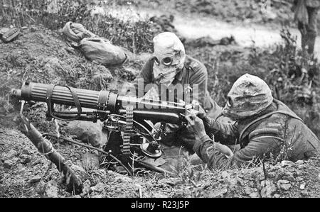 World War I; Vickers Machine Gun Crew from the Machine Gun Corps (MGC) with PH-type anti-gas helmets during the Battle of the Somme near Ovillers. July 1916 Stock Photo