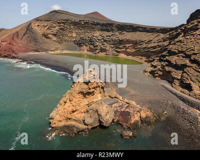 Aerial view of the Charco de los Clicos, a small salt-water lake with an emerald green color set. Lanzarote, Canary Islands, Spain Stock Photo