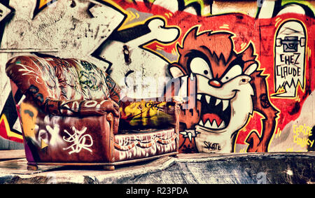 Sofa in a disused warehouse Stock Photo
