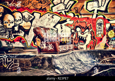 Sofa in a disused warehouse Stock Photo