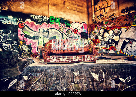 Sofa in a disused warehouse Stock Photo