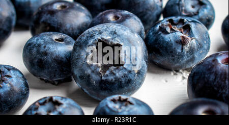 Fresh blueberries over a white wood table Stock Photo