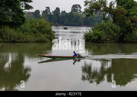 Don Det, Laos - April 24, 2018: Boat crossing the Mekong river near Cambodian border Stock Photo