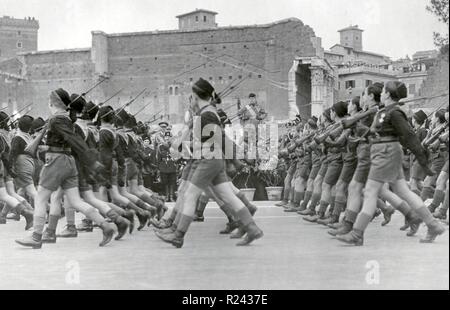Benito Mussolini (1883-1945) Italian politician, journalist, and leader of the National Fascist Party reviews fascist youth in Rome 1934 Stock Photo