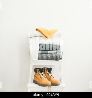 Warm clothing, blankets, boots and cap for winter, square crop Stock Photo