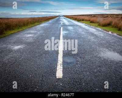 An empty, open road in wet weather in Exmoor National Park Devon UK Stock Photo