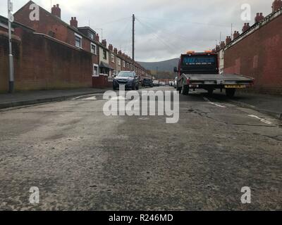 The scene near to where two AK47 assault rifles, two sawn-off shotguns, a high-powered rifle with a silencer fitted, three pipe bombs and more than 100 assorted rounds of ammunition were stored in the building that went on fire on Rodney Drive in west Belfast on Wednesday. Stock Photo