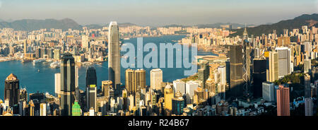 View over Victoria Harbour at sunset, seen from Victoria Peak, Hong Kong Island, Hong Kong, China, Asia Stock Photo