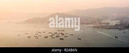 Boats in Victoria Harbour at sunset, seen from Victoria Peak, Hong Kong Island, Hong Kong, China, Asia Stock Photo