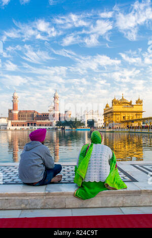 Sikhs at The Golden Temple (Harmandir Sahib) and Amrit Sarovar (Pool of Nectar) (Lake of Nectar), Amritsar, Punjab, India, Asia Stock Photo