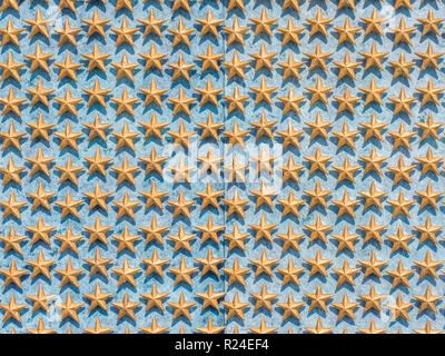 many golden stars on blue background Stock Photo
