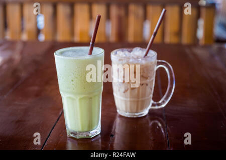 Fresh prepared sweet ice cold thai milk and green tea in local restaurant in Krabi town. Traditional thai cuisine made of fresh ingredients. Stock Photo