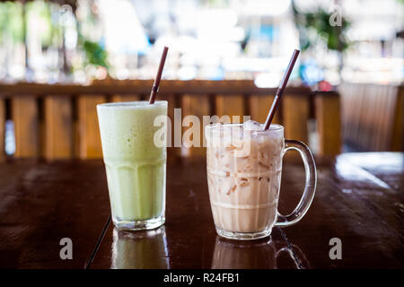 Fresh prepared sweet ice cold thai milk and green tea in local restaurant in Krabi town. Traditional thai cuisine made of fresh ingredients. Stock Photo