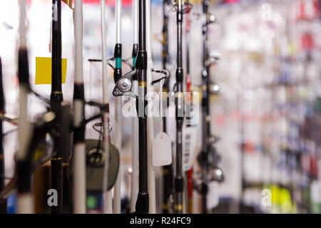stand with assortment of fishing rod in the sports shop indoor Stock Photo  - Alamy
