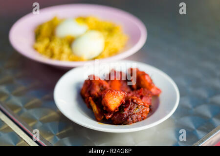 Fresh prepared malaysian tandoori chicken set served with hard boiled eggs and rice in local restaurant in Cameron Highlands. Traditional asian cuisin Stock Photo