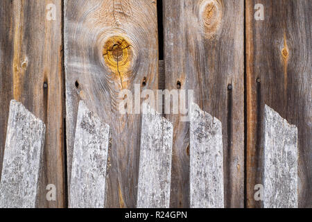 wooden fence, knot and country house wall Stock Photo