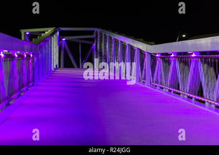 beautiful city bridge with purple and blue lights modern city architecture in scheveningen the netherlands urban city scenery Stock Photo