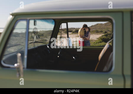 Couple kissing on beach Stock Photo