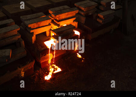 Molten metal in moulds Stock Photo