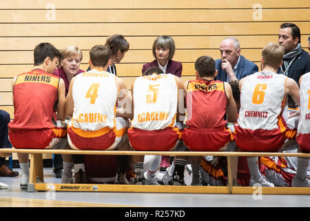 Chemnitz, Germany. 16th Nov, 2018. German Chancellor Angela Merkel (2nd L) talks with members of the basketball club Niners Chemnitz during her visit in Chemnitz, eastern Germany, on Nov. 16, 2018. Angela Merkel on Friday clarified her refugee policy during her visit to Chemnitz, a place regarded as the center of several severe xenophobic protests months ago. Credit: Kevin Voigt/Xinhua/Alamy Live News Stock Photo