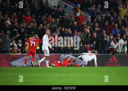 16th November 2018, the UEFA Nations League match Wales v Denmark at the Cardiff City Stadium. Ethan Ampadu of Wales is pushed of the pitch by Kasper Dolberg of Denmark. News use only. Credit: www.garethjohn.uk/Alamy Live News Stock Photo