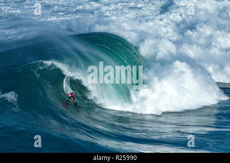 Big wave surfer Kai Lenny (HAW) is seen riding a wave during the Nazare Challenge, Portugal. The first stage (Nazaré Challenge) of the World Surf League (WSL) Big Wave Tour took place in Nazaré, Portugal. South African surfer Grant Baker won the Portuguese competition. Stock Photo