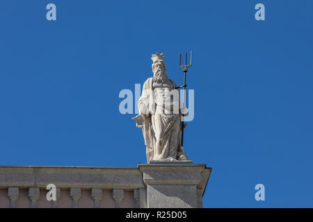 Statue of Roman god Neptune (Greek Poseidon) at the old Stock Exchange building (Palazzo della Borsa Vecchia) in Trieste, Friuli Venezia Giulia, Italy Stock Photo