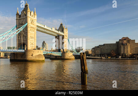 London, England, UK - March 11, 2011: Morning sun illuminates the gothic architecture of London's iconic Tower Bridge. Stock Photo