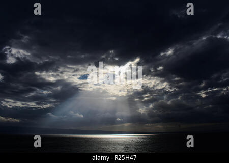 rays of the sun beautifully make their way through the clouds/ Conceptual image of hope Stock Photo