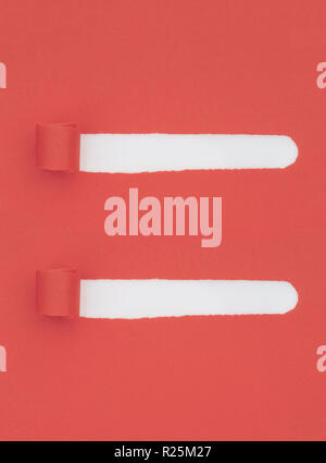 Torn, ripped red paper with white underneath, curled and rolled. Two strips removed to leave holes. Background. Stock Photo