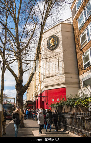 LONDON, UK - March 20 2018: People standing in line at the entrance to the Madame Tussauds museum in London on a sunny day. Stock Photo