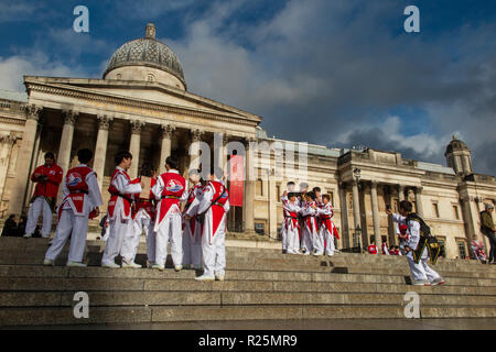 Korean children practice their Martial Arts outside the National Gallery in Trafalgar Square Stock Photo