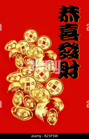 Chinese Gold Coins and Ingots on Red background with New Year Greetings -  Prosperous New Year Stock Photo