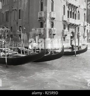 1950s, historical view of Venice, the famous Italian city of small islands or lagoons seperated by canals in the country's Northern Veneto region. Exciting and romantic, the city is full of historic churches, palazzi, ancient bridges and monuments and of course the famous gondolas, the traditional, flat-bottomed Venetian rowing boats seen here. Stock Photo