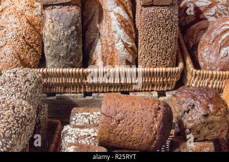 a selection or variety of loaves wholemeal, white and granary at an artisan bakery at borough market in london. Stock Photo