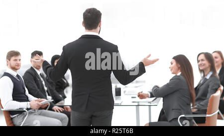 rear view .the businessman holds a briefing with the business team Stock Photo