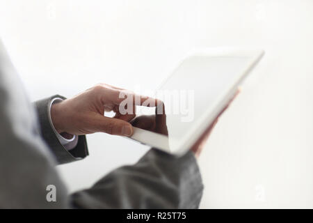 close up.the businessman's hand presses on the screen of a digit Stock Photo