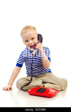 little boy with telephone isolated on a white background Stock Photo