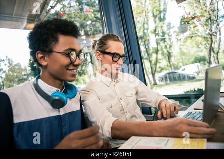 Joyful nice students preparing together for the exam Stock Photo