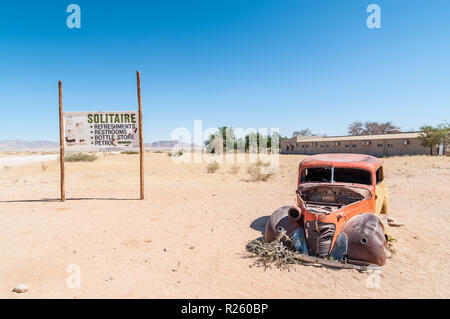 car wreck, billboard, road sign, Solitaire, Namibia Stock Photo