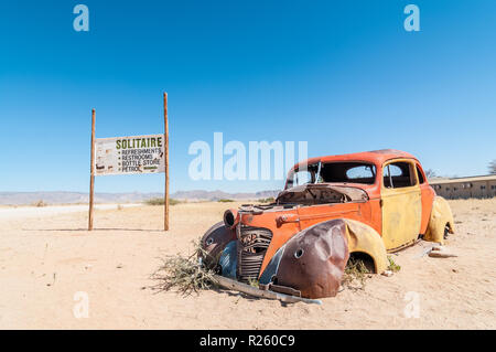 car wreck, billboard, road sign, Solitaire, Namibia Stock Photo